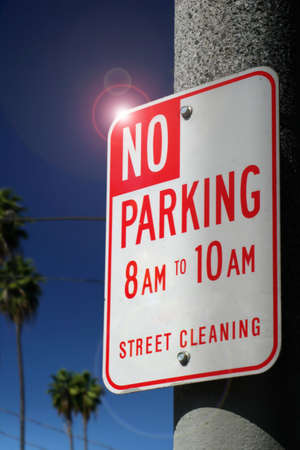 no parking sign on pole against dark blue skyの写真素材