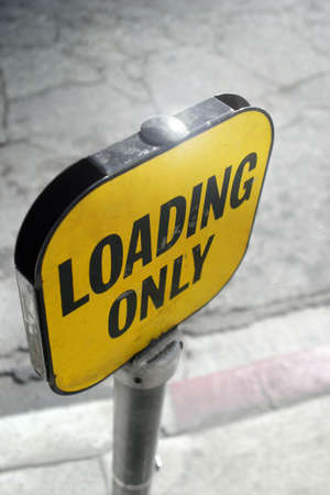 loading only sign on a sunny streetの写真素材