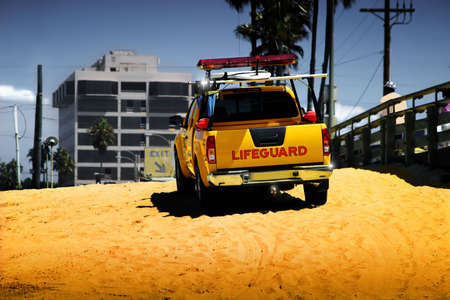 Bright colorful photo of life guard truck on the beachの写真素材