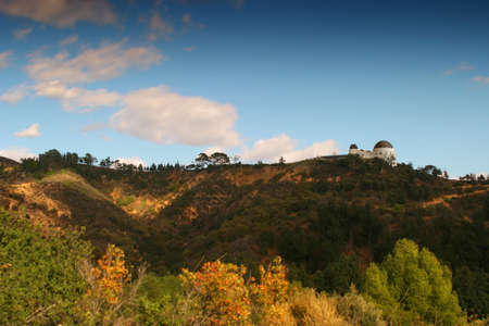 A rolling landscape with blue sky and cloudsの写真素材