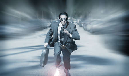 Stylized portrait of running businessman with briefcase on the goの写真素材