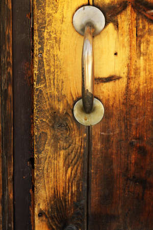 Old wooden door with doorknobの写真素材