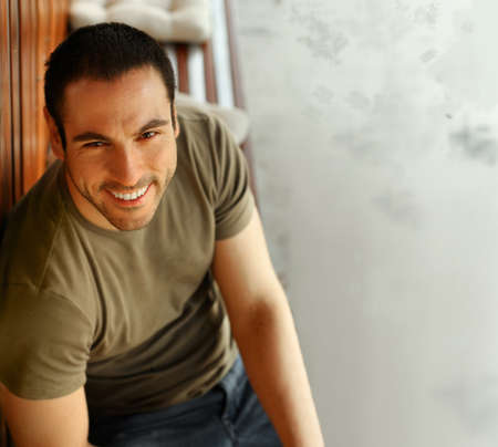 Happy smiling casual guy smiling outdoorsの写真素材