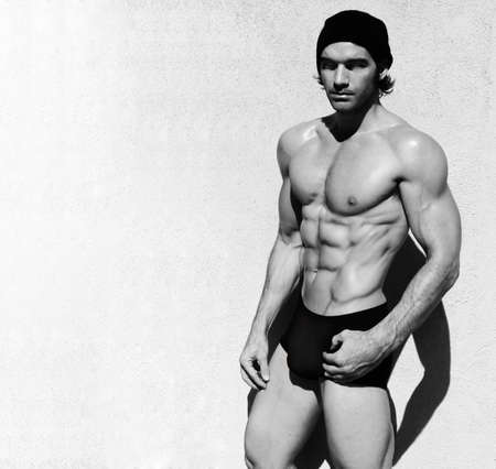 Sexy fine art black and white portrait of a very muscular shirtless male model の写真素材