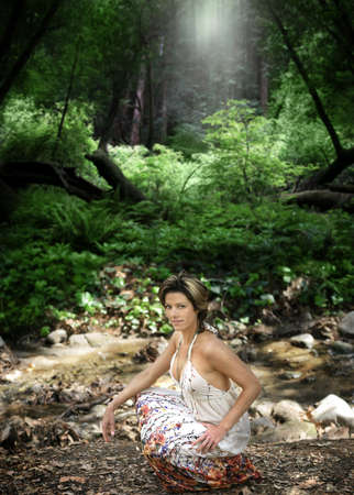 Portrait of a beautiful natural woman in forest outdoorsの写真素材