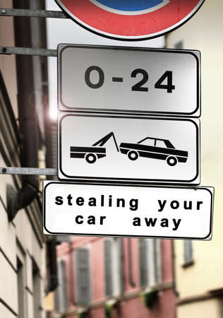 No parking, tow away zone traffic sign with words "Stealing Your Car Away"の写真素材