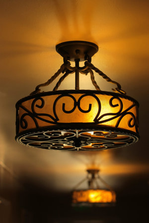 Vintage art deco ceiling lamp fixture in dark hallway