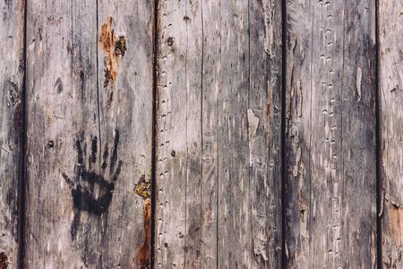 Hand print on a wooden wallの写真素材
