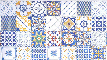 typical sicilian floor and wall tiles in different patterns and design in blue, yellow and white colorの写真素材