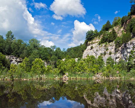 landscape of bluffs reflected in a lakeの写真素材