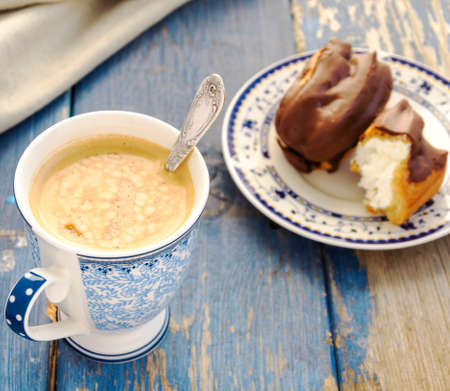 Coffee and eclairsの写真素材