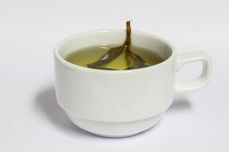 Tea in cup with white back groundの写真素材