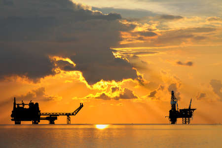 Gas platform and Rig platform in sunset or sunrise timeの写真素材