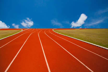 Running track over blue sky and clouds, Athlete Track or Running Trackの写真素材