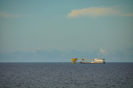 barge and tug boat in open sea,Oil and gas platform in the gulf or the sea, The world energy, Offshore oil and rig construction の写真素材