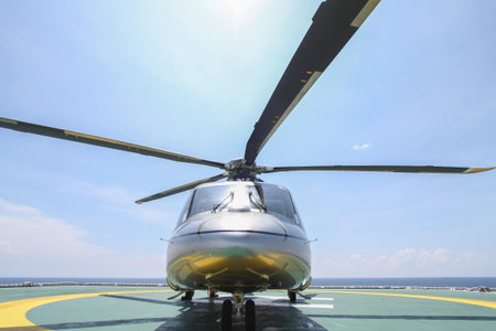 helicopter parking landing on offshore platform. Helicopter transfer crews or passenger to work in...
