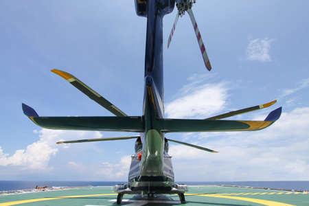 helicopter parking landing on offshore platform. Helicopter transfer crews or passenger to work in...