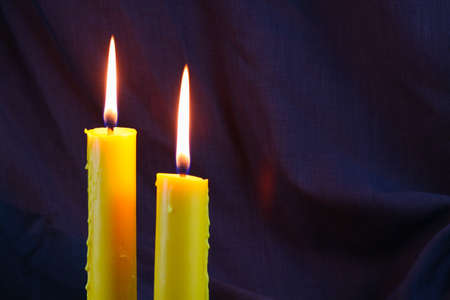 Candlelight close up over black, Halloween day background.の写真素材