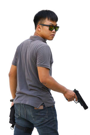 Spy man in the mission, Killer mission, Portrait Of Young Man With Gun On White Backgroundの写真素材
