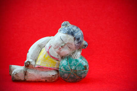 China doll on red background, for Chinese new yearの写真素材