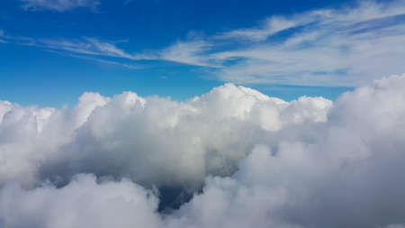 View from airplane window, Top view from airplane, Clouds on the sky and view from airplane window.の写真素材