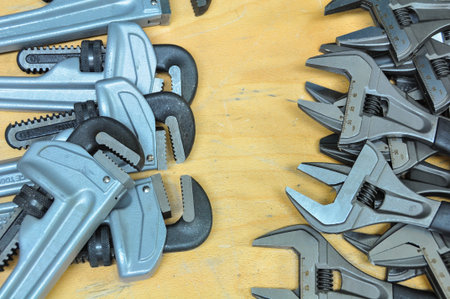 set of hand tools on a wooden background, Wrench tools or Pipe wrench for hard work.