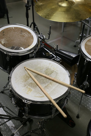 Drum set in training room. Music equipment in training room.