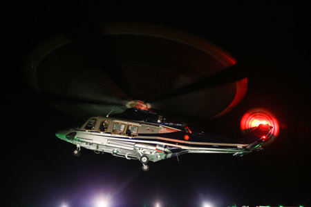 Helicopter landing in offshore oil and gas platform on deck or parking area. Helicopter night flight...