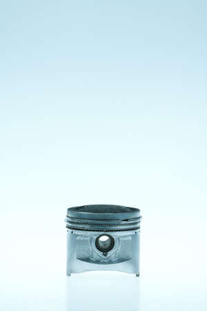real used aluminum piston isolated over white backgroundの写真素材