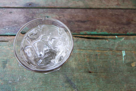 Fresh water in glass on wooden table.の写真素材