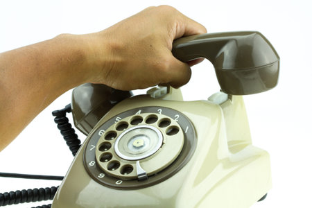 Old telephone or vintage telephone on white background.