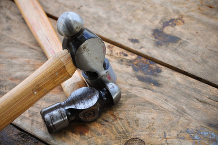 Hammer set of hand tools or basic tools on wooden background.
