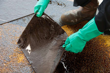 oil spill cleanup on working area. danger for the nature.の写真素材