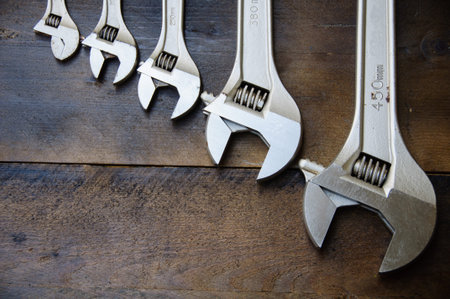 Spanner or adjustable wrench on wooden back ground, Basic hand tools.