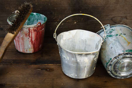 Paint cans or paint bucket on wooden background.の写真素材