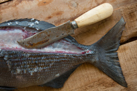 Fresh fish from the sea on wooden background, Healthy foods background.