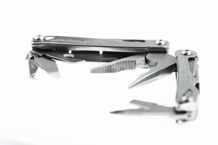 Pocket knife or Steel multi-function tools isolated on white background. Hand tools in industry jobs.の写真素材
