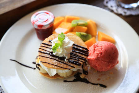 close-up sweet cake set on wooden table.の写真素材