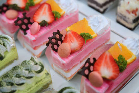 close-up sweet cake set on wooden table.の写真素材