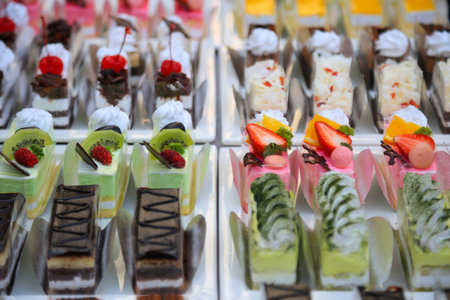 close-up sweet cake set on wooden table.の写真素材