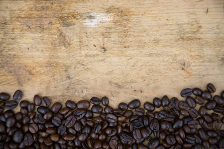 Coffee beans background on wooden, Fresh coffee beans with coffee cup on wooden background, Drinking set background.の写真素材
