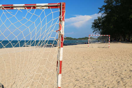 Beach football pitch on a sunny day, popular sport on the beach.の写真素材