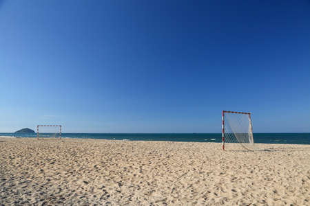 Beach football pitch on a sunny day, popular sport on the beach.の写真素材