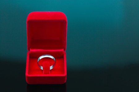 Wedding rings background, beautiful silver ring in red box for wedding concept.