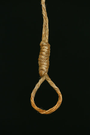 bankrupt concept, rope noose with hangman's knot hanging in front, Halloween background.