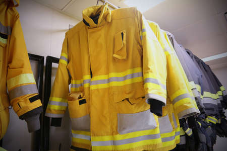 firefighter suit and equipment ready for operation, Fire fighter room for store equipment, Protection equipment of fire fighter.の写真素材
