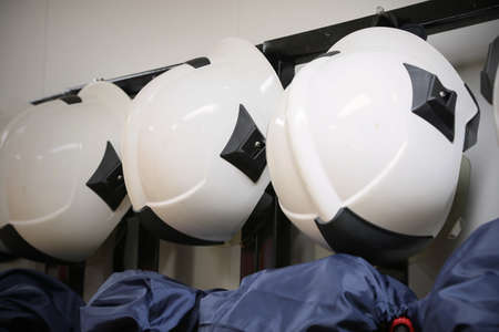 firefighter suit and equipment ready for operation, Fire fighter room for store equipment, Protection equipment of fire fighter.の写真素材