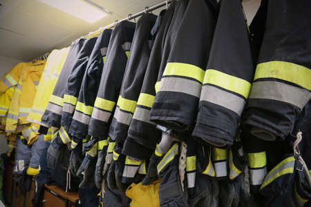 firefighter suit and equipment ready for operation, Fire fighter room for store equipment, Protection equipment of fire fighter.の写真素材