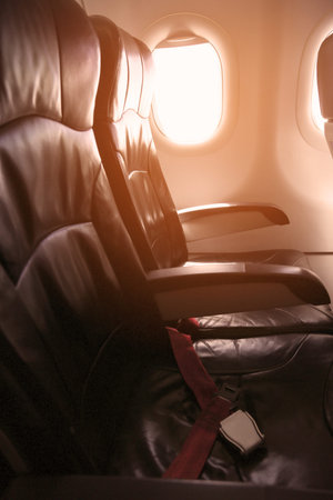 Lonely travel by airplane to somewhere, Journey for business by airplane and see out of airplane window, Sky view of Airplane from high level, Airplane interior for first class level and support VIP.の写真素材