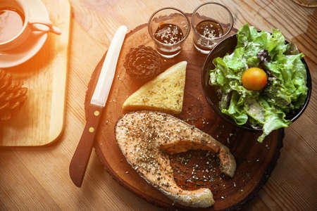 Salmon steak on wooden tableの写真素材